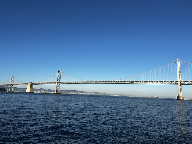 San Francisco Bay Bridge clear blue sky and rolling water
