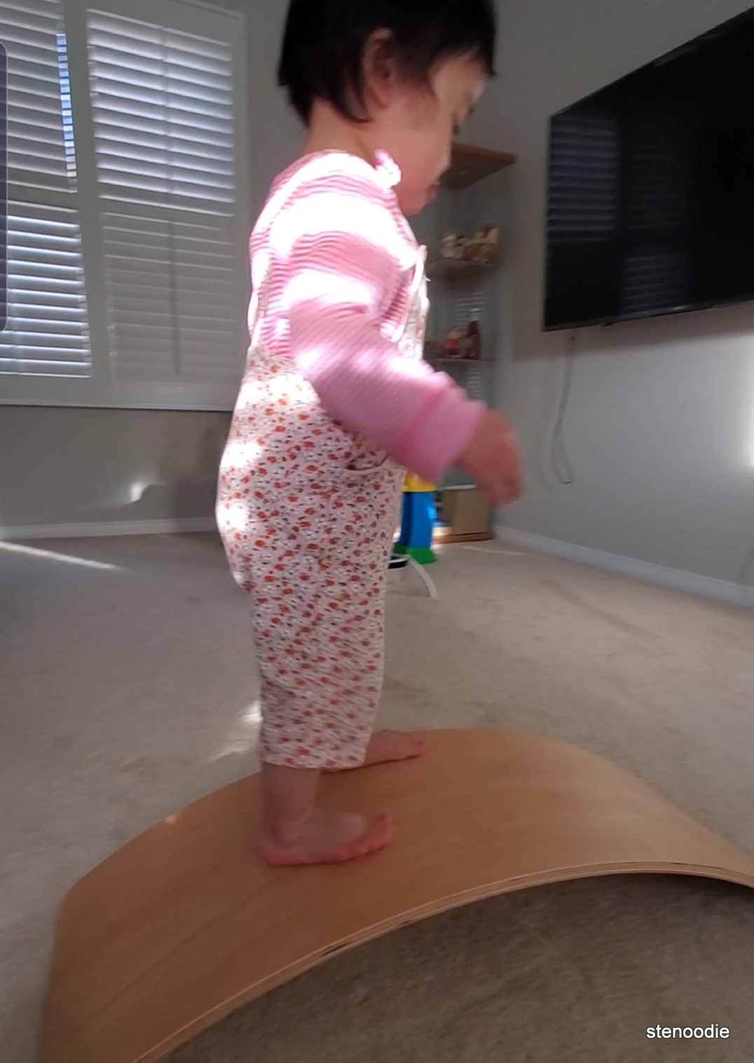 Toddler on balance board