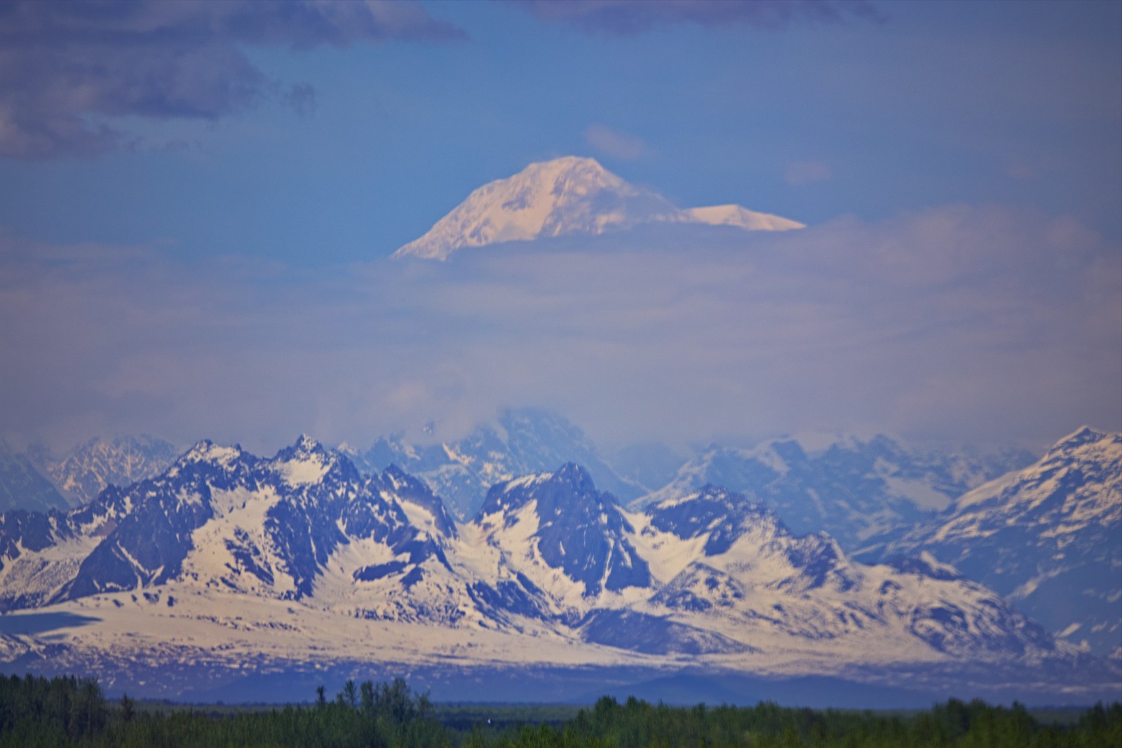 Denali peak above the clouds and the Alaska range