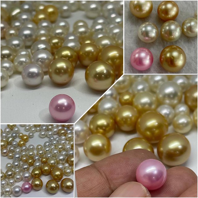 Unusual pink pearl alone amongst other South Sea Pearls