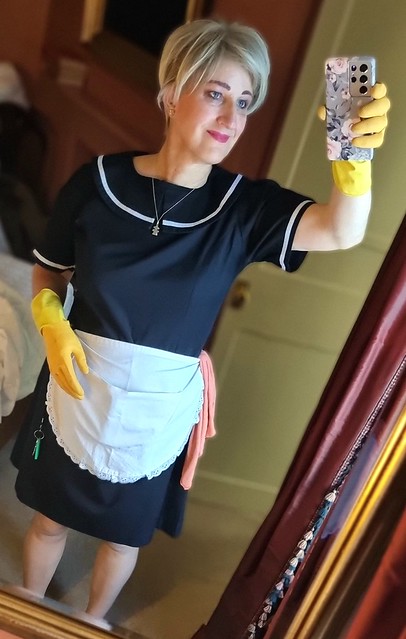 Happy maid in her rubber gloves