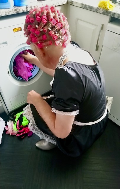Sissy loading her panties into the washing machine