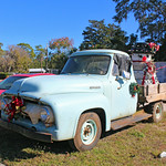 Ford F-250 Truck Decorated for Christmas, Chiefland Vintage flatbed truck was parked in front of a business by Highway 19 and had several old tires decorated as a snowman among its decorations.