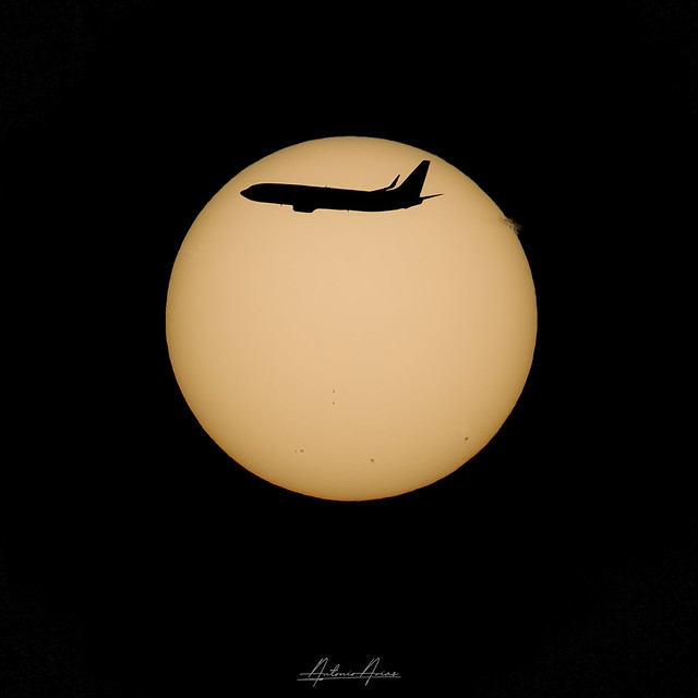 Plane over the sun