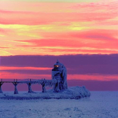 To get the angle of the sunset in winter Gary was about 1/4 of a mile out onto the frozen lake. He says "it felt like he was on an alien world...no sounds but the wind and the creak and groan of the ice beneath my feet." Photo courtesy and copyright Lighthouse Photographer Gary Martin. From Lighthouses of Michigan's Sunset Coasts