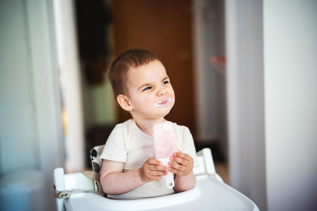 Happy kid eating icecream