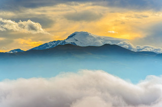 Cloud bank and sunrise on the Cayambe volcano (in Explore)
