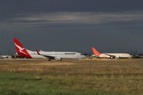 Qantas Boeing 737-838 VH-VXJ and Air India Boeing 787-8 Dreamliner VT-ANJ waiting to take off from runway 34