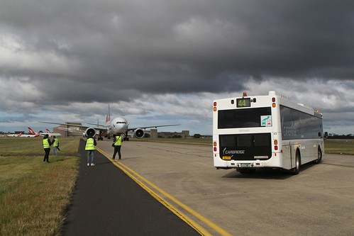 Carbridge bus #43 BS04UB waiting on taxiway Sierra while us planespotters are busy photographing the parked planes up ahead
