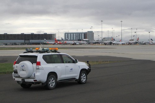 Melbourne Airport airside safety car waiting to lead our bus out to the next photo spot airside