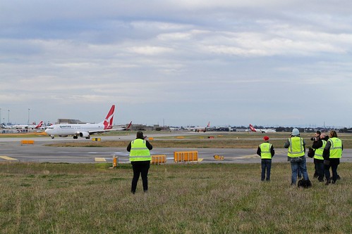 Our group of airside planespotters photograph a passing Qantas 737