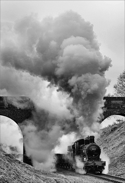 Ex-GWR Collett Dukedog 4-4-0 no. 9017 passes under Three Arch Bridge south of Horsted Keynes at the head of a northbound engineer's goods train on the morning of 5th February 2010.