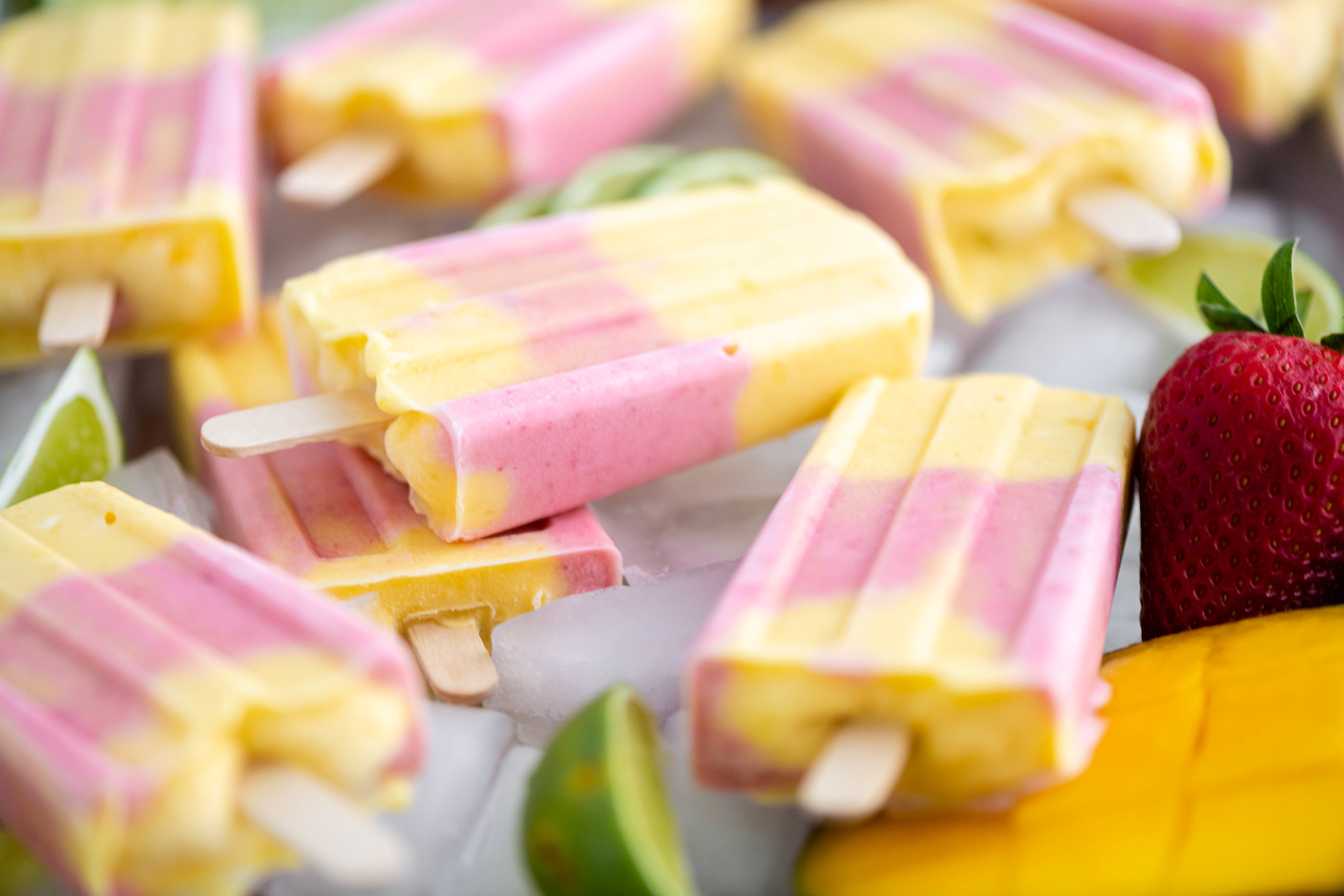 Layer of ice topped with strawberry mango popsicles.