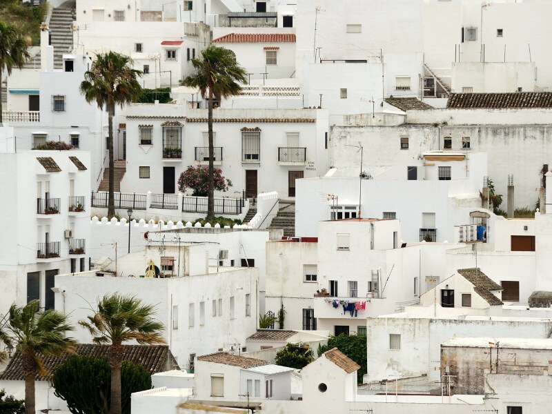 A close up of white houses one next to another