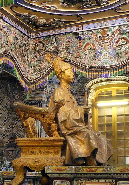 The statue of the king called Khai Dinh in his royal tomb in Hue, Vietnam was decoration overload