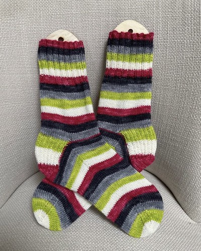 Debbie (@love.knit.spin.weave) finished this pair of vacation knitting socks for her husband using Timber Yarns Sock Twins in Christmas Jewells!