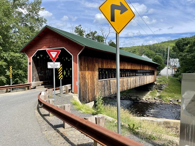 Ware-Gilbertville Covered Bridge in Ware, Massachusetts. Spanning Ware River. Built in 1886. NRHP listed in 1986.  The midpoint of the bridge is both the town and county line.