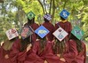 mortarboards decorated with colleges