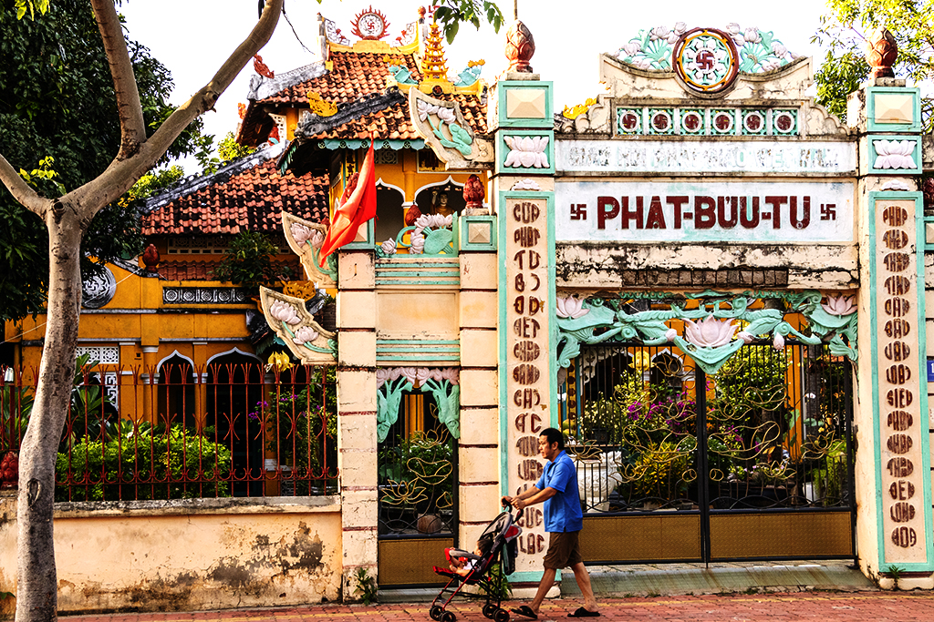 Man with stroller in front of Phat Buu Tu Temple on 6-15-22--Vung Tau copy