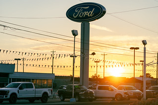 Yakima, Washington - July 6, 2021: Sunset falls on a Ford car and truck dealership in the summer