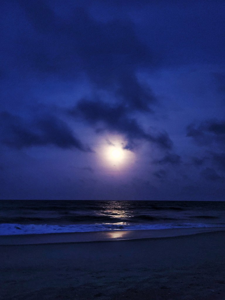 Strawberry moonrise over Kure Beach