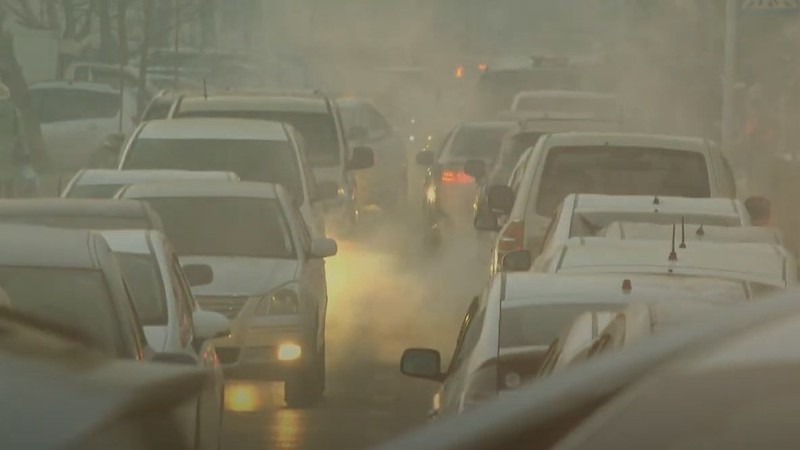 Cars in polluted atmosphere
