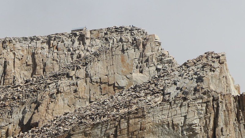 Zoomed-in view of the Summit Hut on Mount Whitney, with the Keeler Needle and Crooks Peak in the foreground