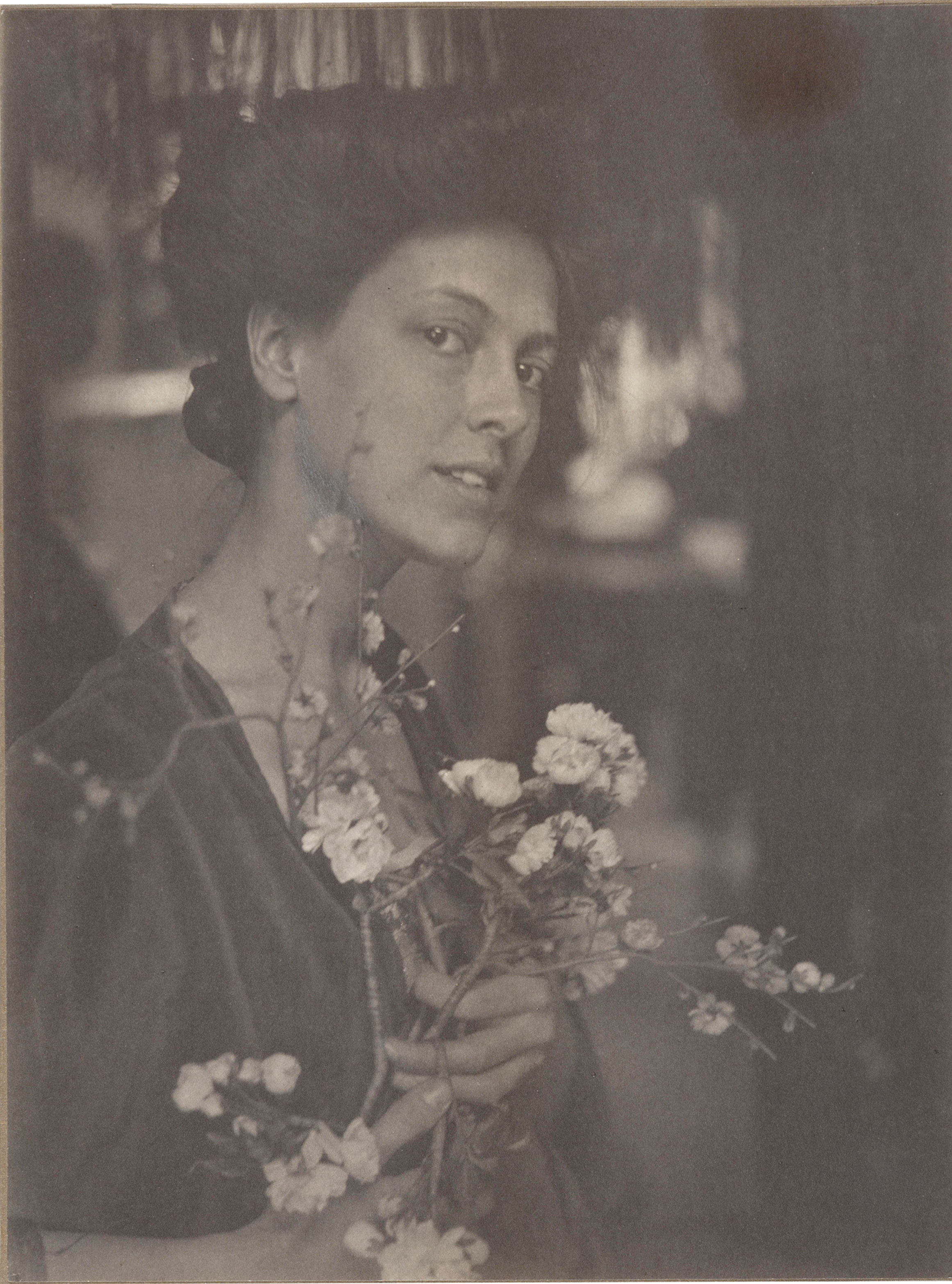 Gertrude Käsebier · Untitled (Portrait of a woman with cherry blossoms), ca. 1905. Platinum print. | src Christie's