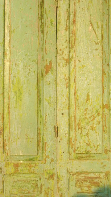 lime green door in weathered wood in Laos