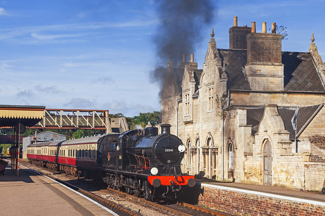 Ex-SR Maunsell Q Class 0-6-0 no. 30541 puts up some smoke as it passes through Wansford Station with an eastbound passenger train on the warm day of 9th September 2016