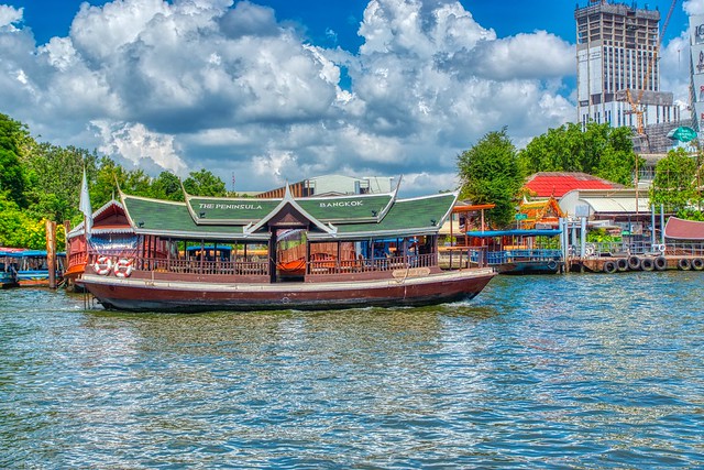 Shuttle boat of the Peninsula hotel on the Chao Phraya river in Bangkok, Thailand