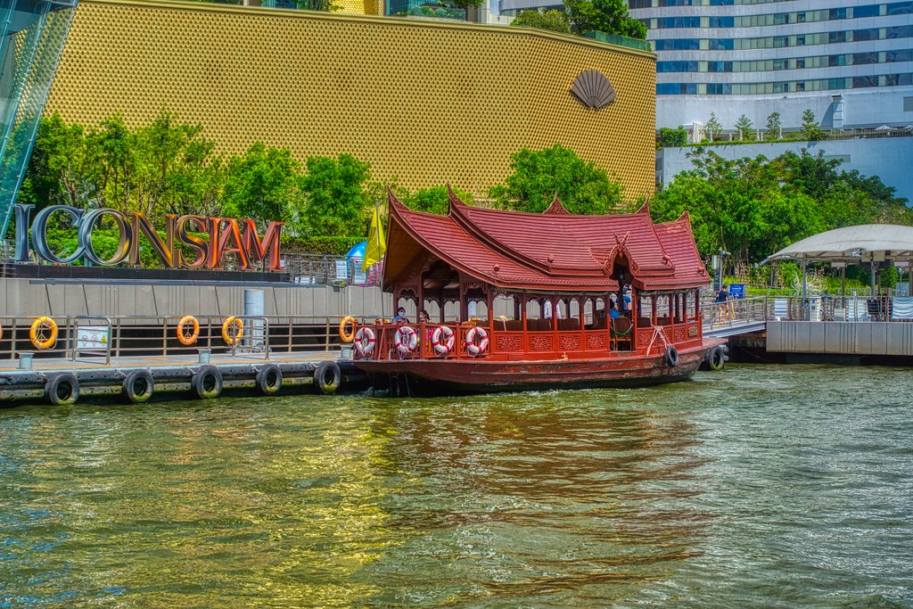 Shuttle boat of Mandarin Oriental hotel at the pier of ICON SIAM luxury shopping mall on the Chao Phraya river in Bangkok, Thailand