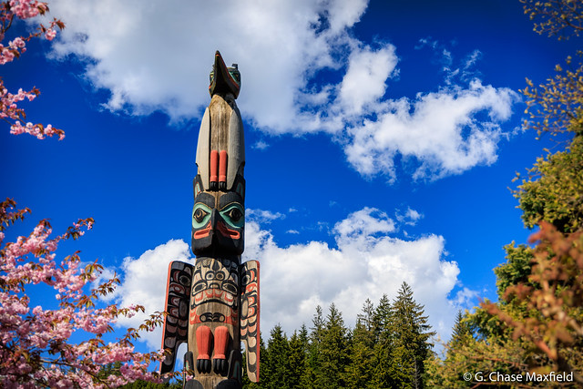 A totem pole and flowers in Ketchikan, Alaska