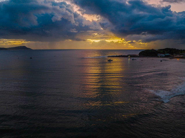 Aerial sunrise at the seaside with rain clouds