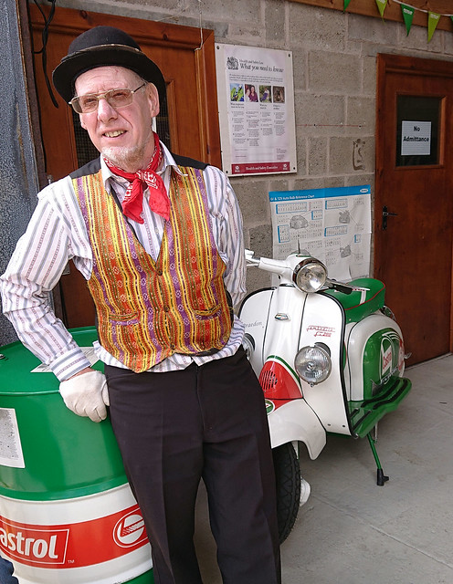 The organist and a castrol moped at the Classic car & Transport event Southport