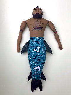 Merman with tall ship tattoos