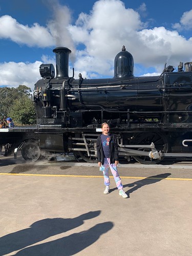 huff in front of a steam engine