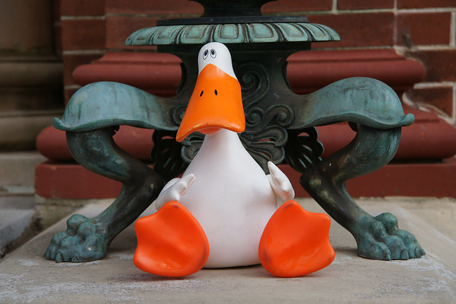 Murduck at the base of a clawfoot lamp