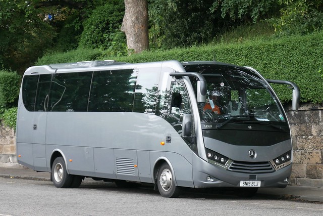 Clarke's  Executive Travel of Gourock Mercedes Benz 1024L Unvi Voyager GT SN19BLJ at Regent Road, Edinburgh, on 28 June 2022.
