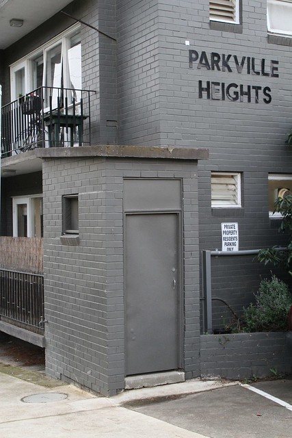 'Caretakers toilet' facing the car park of a walk-up block of flats