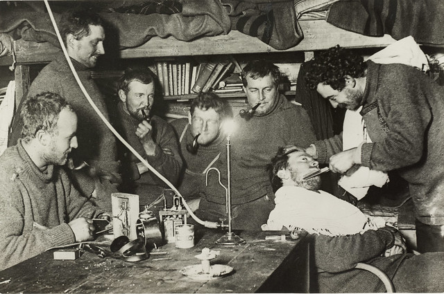Shaving in Antarctic explorers hut, Cape Denison, 1912