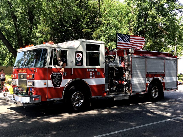 Forest view engine r#81 participating in the Fourth of July parade 2022 .