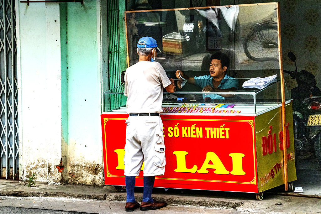Man buying lottery tickets on 7-7-22--Vung Tau copy