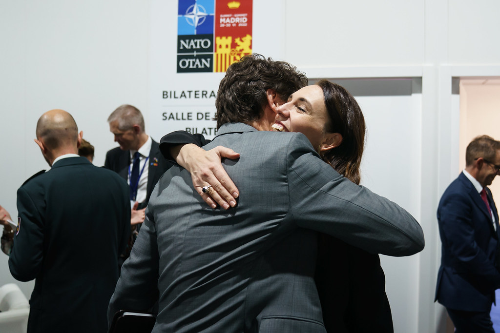 Prime Ministers Jacinda Ardern and Justin Trudeau greet with an embrace