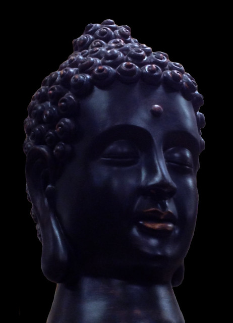 A Black Buddha on a Black Background
