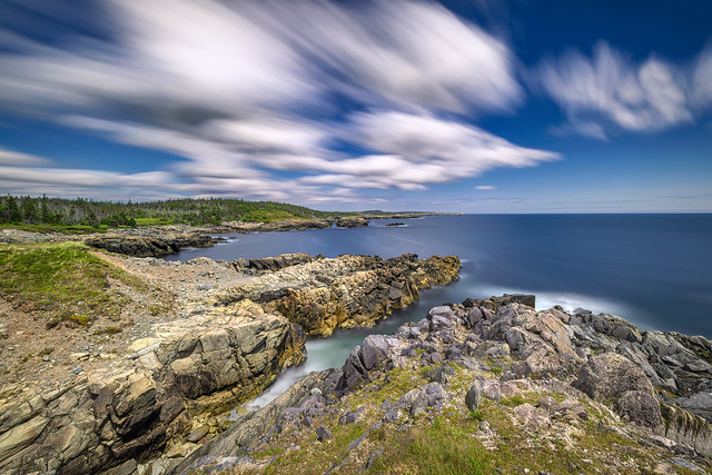 Long exposure of clouds and waves over the Louisbourg Lighthouse Trail, Louisbourg, Nova Scotia, Canada