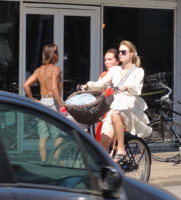 Copenhagen girl on a bike dressed for summer in traffic