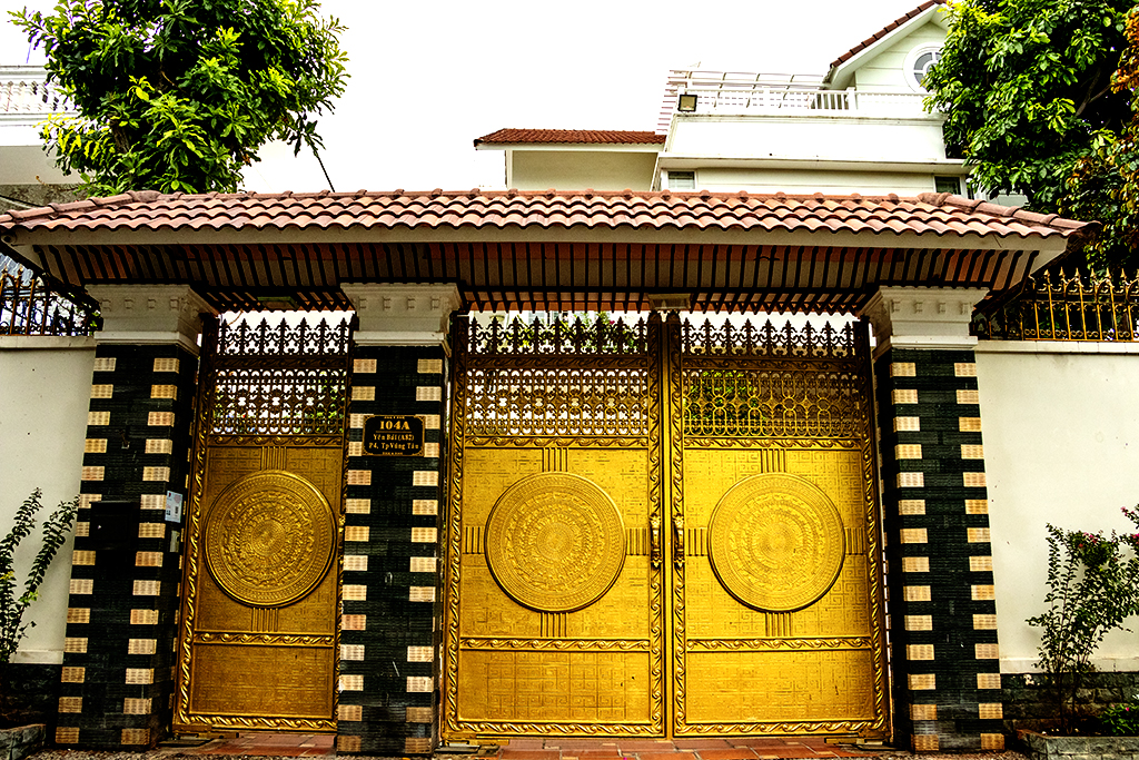 Bronze drum designs on fancy gate on 7-13-22--Vung Tau copy
