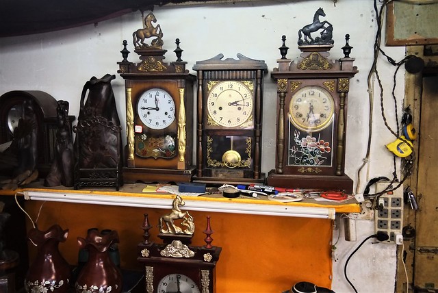 China Wuhan late 2019 flea market store with vintage analogue clocks - 