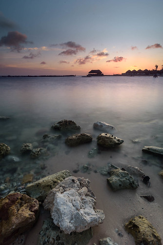 Curacao sunset by Dariusz Wieclawski, caribbean curacao dutchcaribbean sunset dask stillwater water calm serene sun rocks nikon nikond750